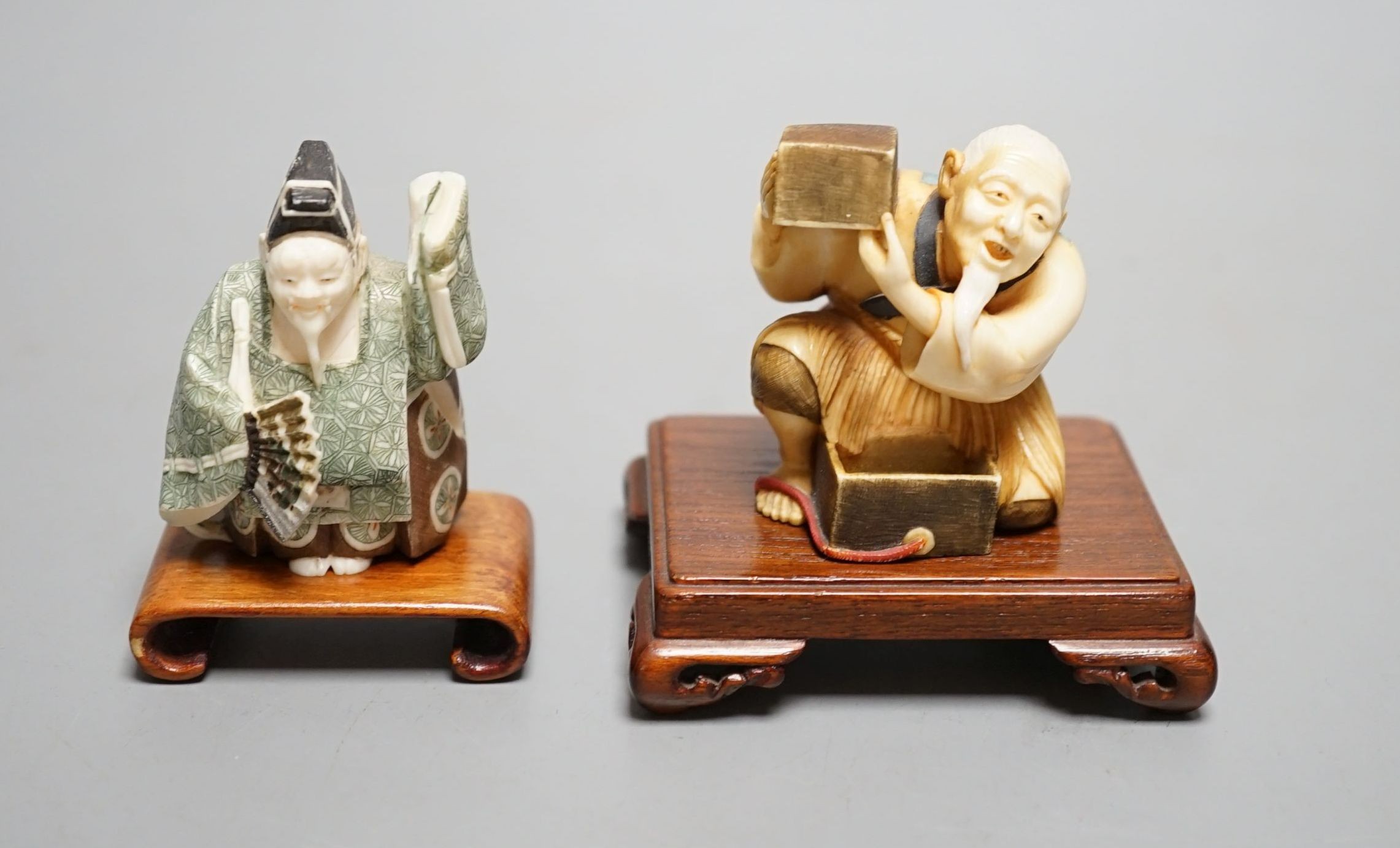 Two Japanese stained ivory okimono-netsuke of a priest and a man with a box, Taisho/early Showa period, signed - 6cm tall